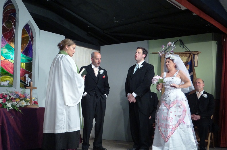 Ruth Ward's stained glass window was a perfect backdrop to the wedding scene.